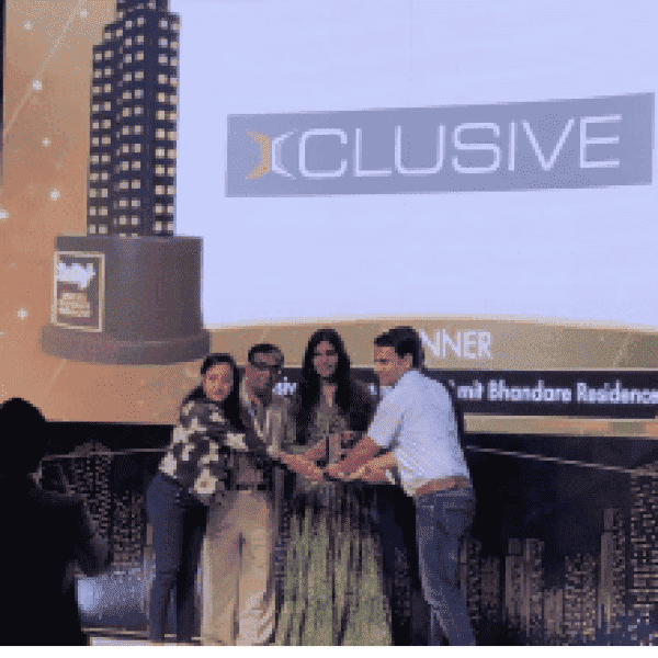 Group receiving an award on stage